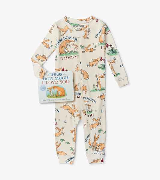 Children's pajama set with fox pattern and book titled 'Guess How Much I Love You' on a white background