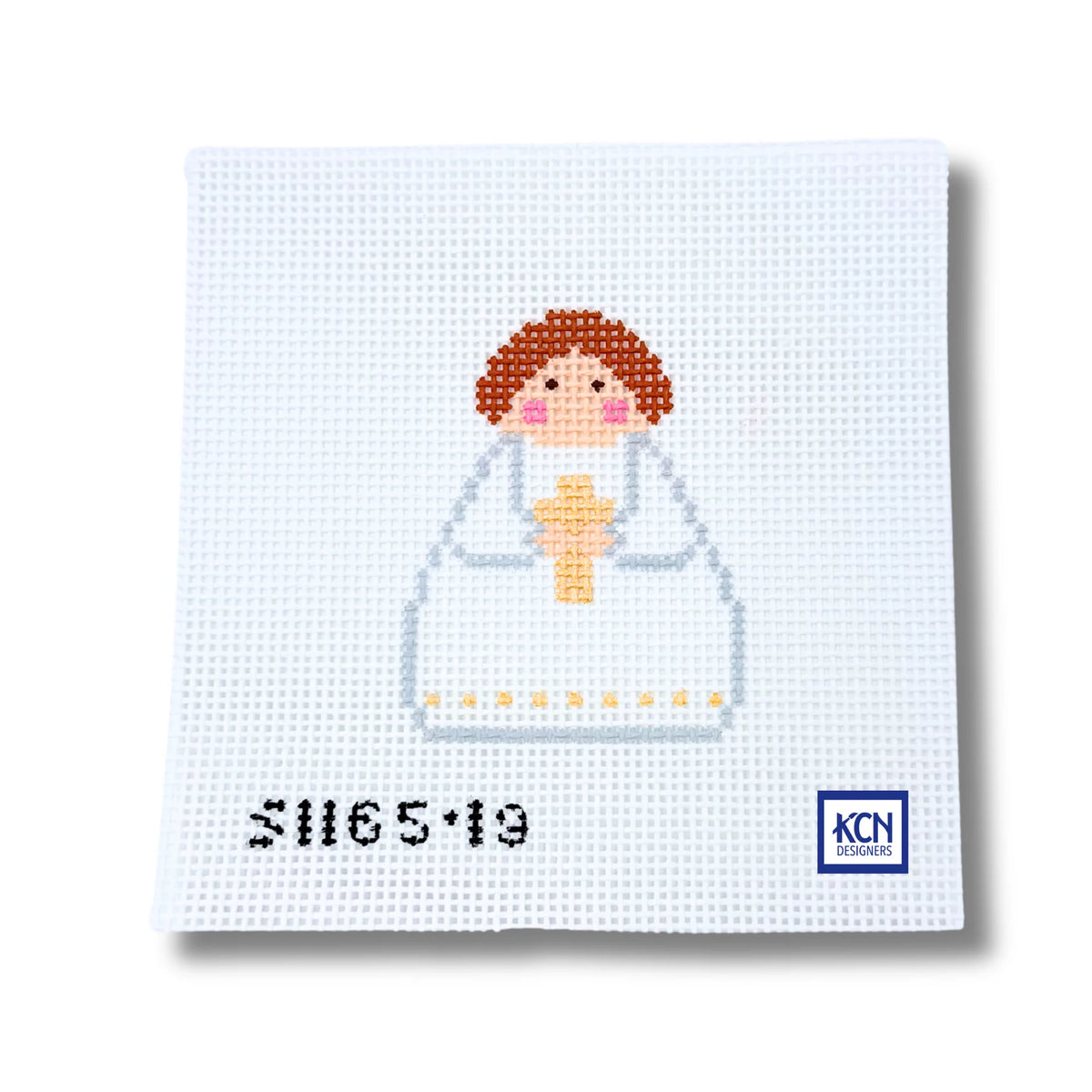 A square white needlepoint canvas featuring a pixelated illustration of a child with brown hair, pink cheeks, and a white dress holding a yellow cross. The black serial number 'S1165-19' is printed on the bottom left, and a blue 'KCN' brand logo is on the bottom right.