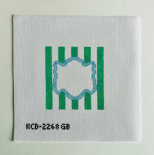 Textile sample with green stripes and a circular design on a light gray background