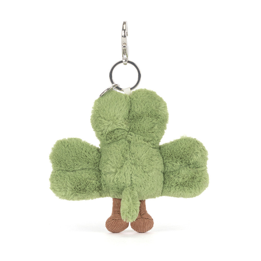 Green plush shamrock keychain on a white background