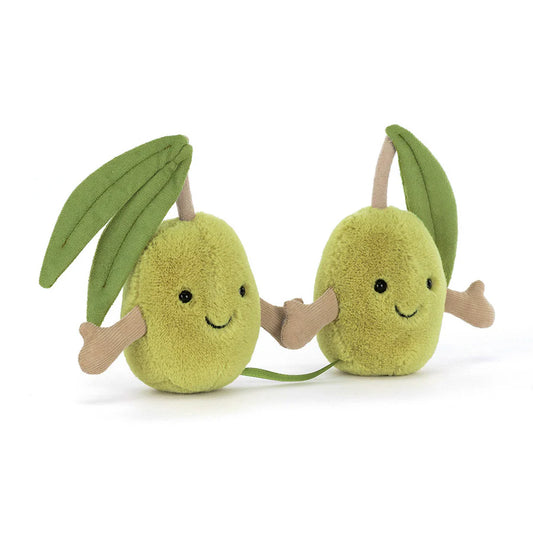Two plush avocado toys with smiling faces on a white background