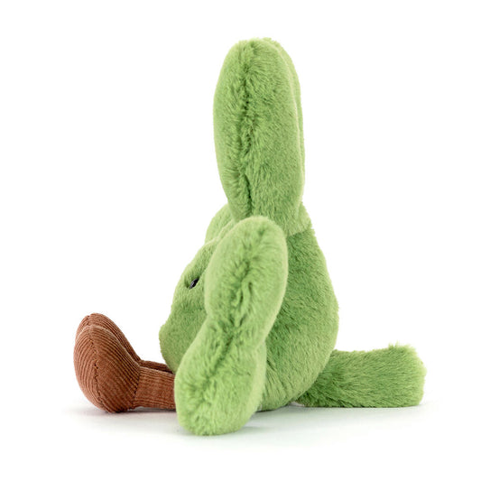 Green plush toy with brown feet on a white background