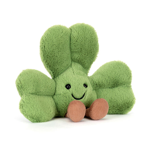 Green plush toy with a happy face on a white background