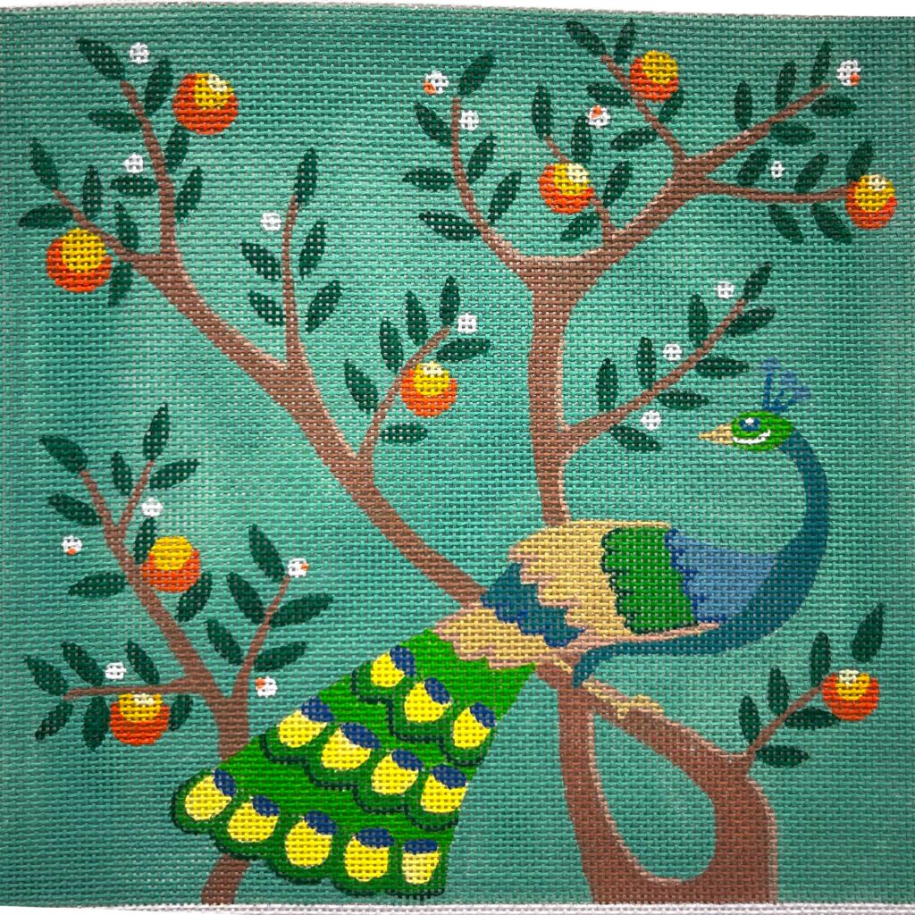 Needlepoint canvas with two peacocks and an orange tree