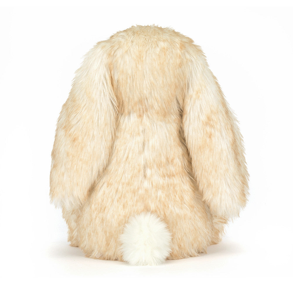 Plush toy resembling a rabbit with long ears on a white background