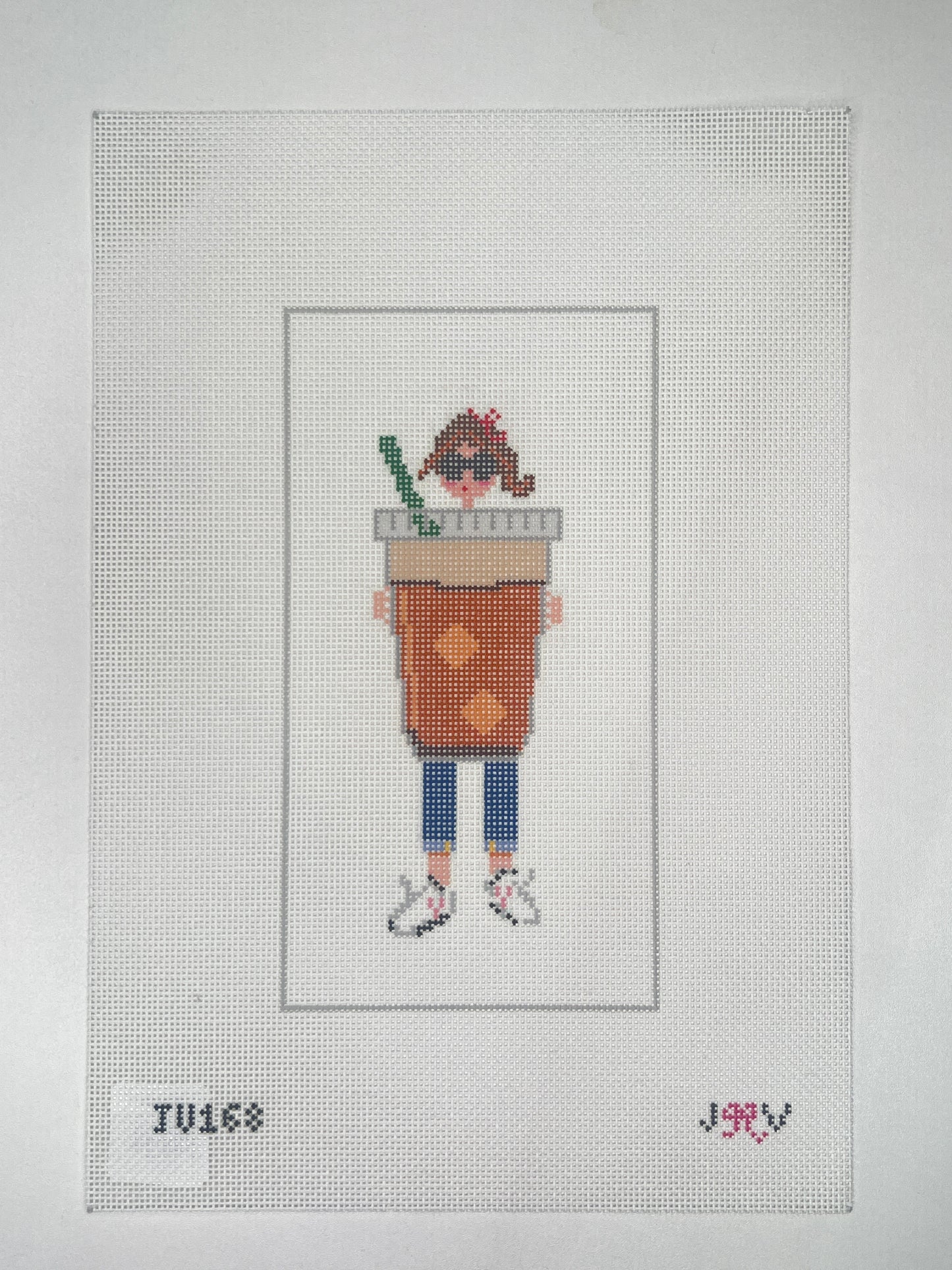 Cross-stitched design of a person with a suitcase on fabric with a grid pattern.