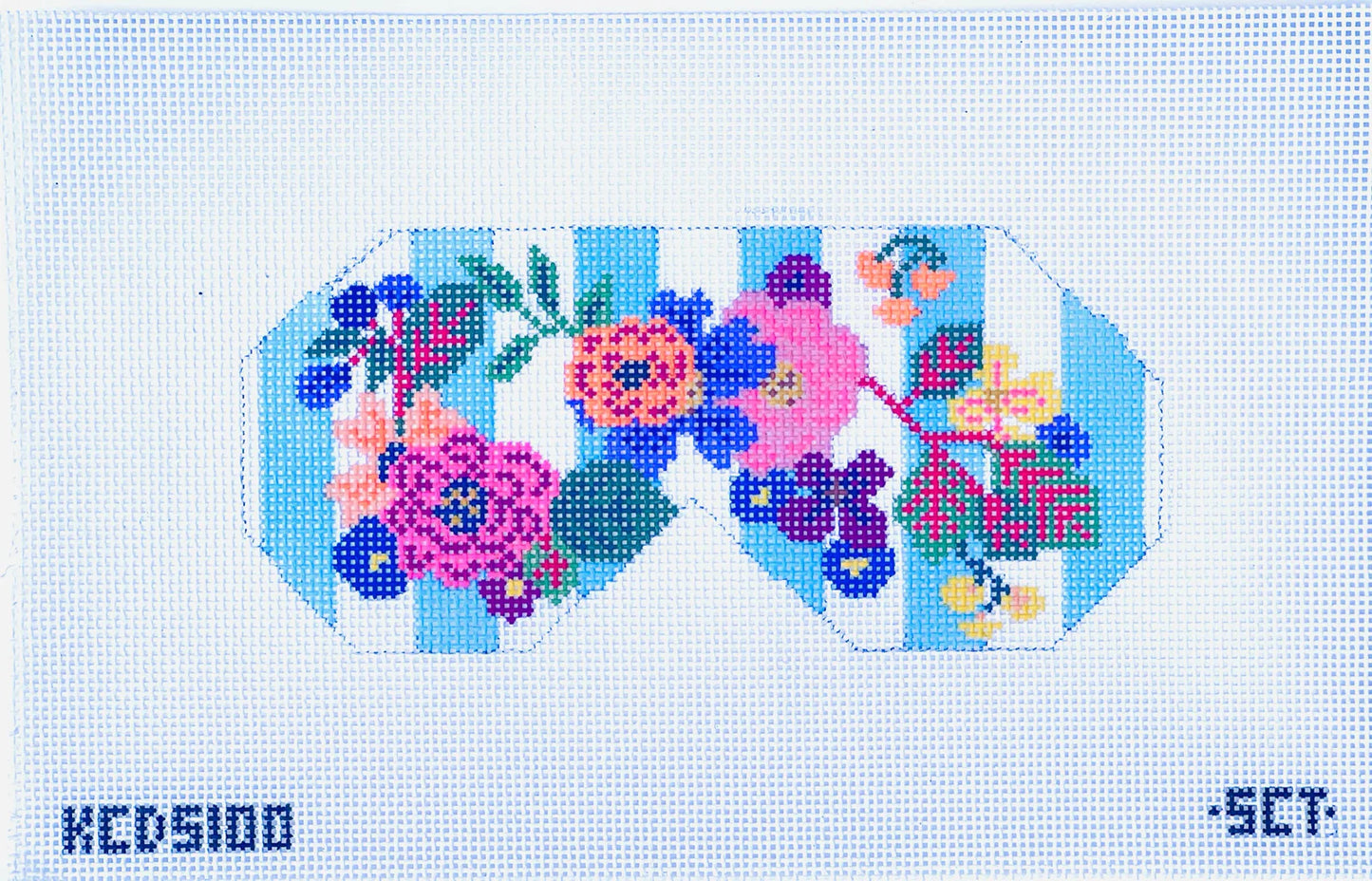 Cross-stitched floral design on a grid background
