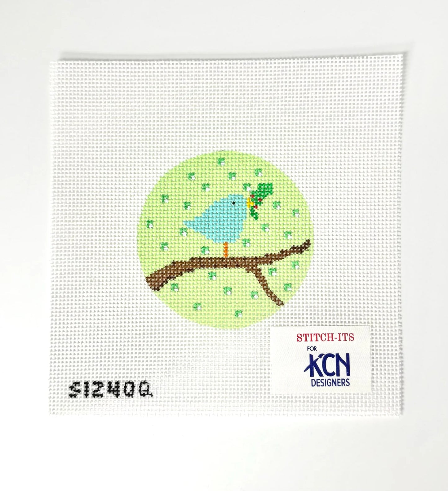 Needlepoint design of a blue bird on a branch with 'KCN Designers' branding.
