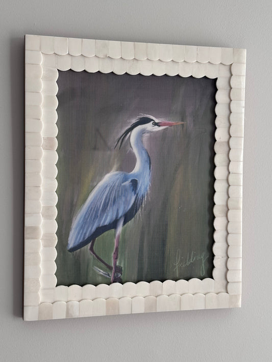 Framed artwork of a bird on a gray background