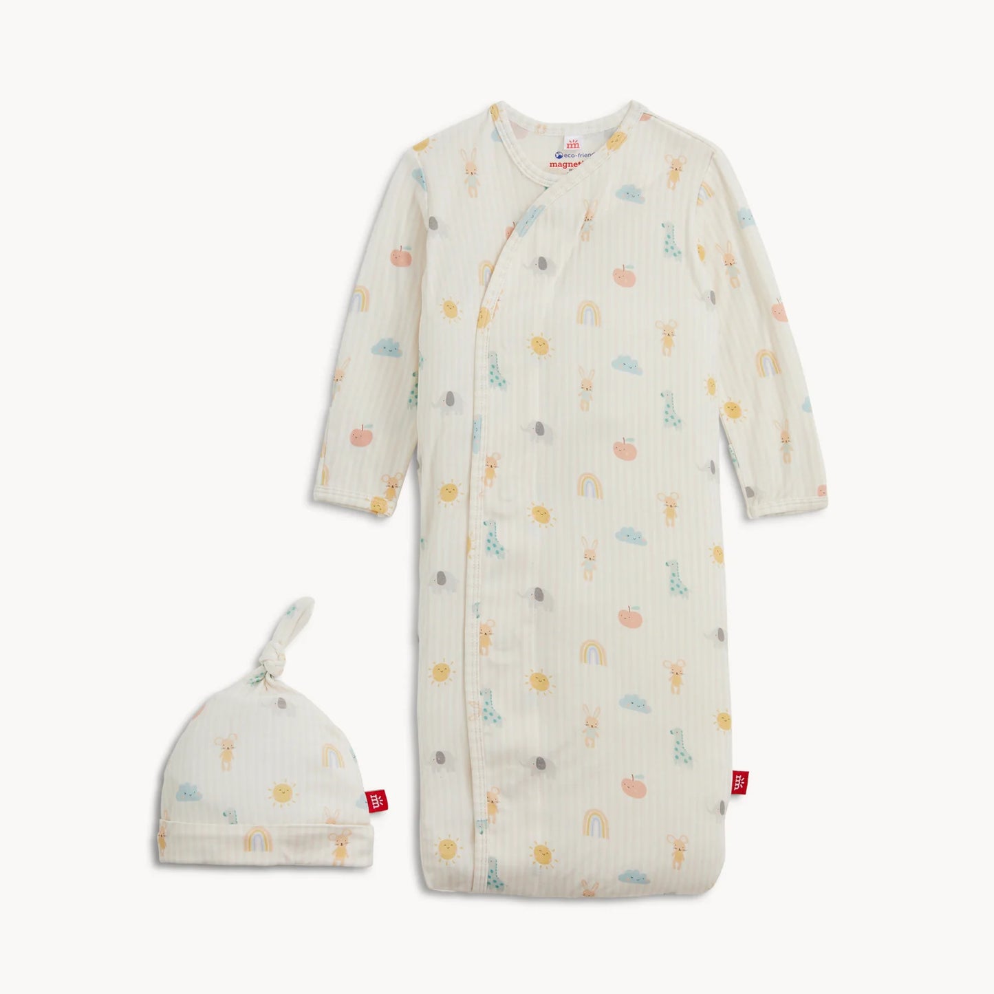 Baby gown with colorful patterns and matching hat on a white background