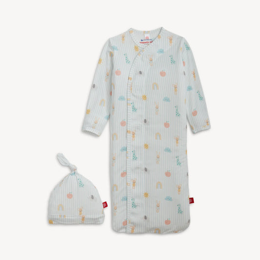 Baby gown with colorful patterns and matching hat on a white background