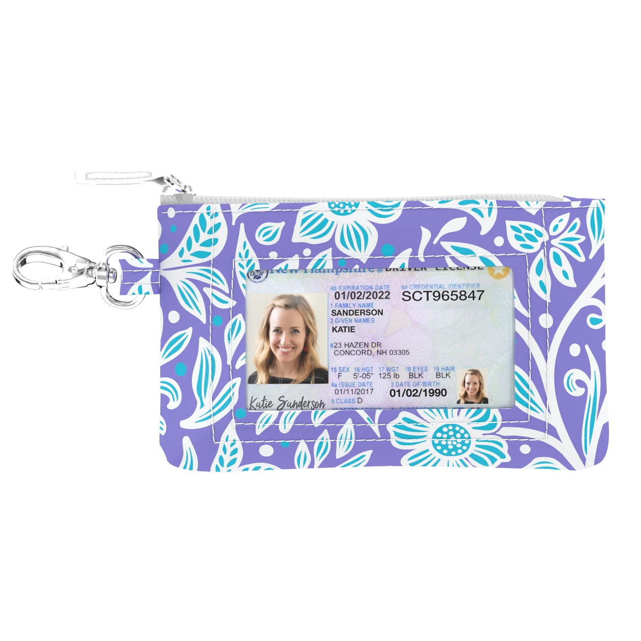 Floral patterned ID holder with a clear window for an ID card on a white background