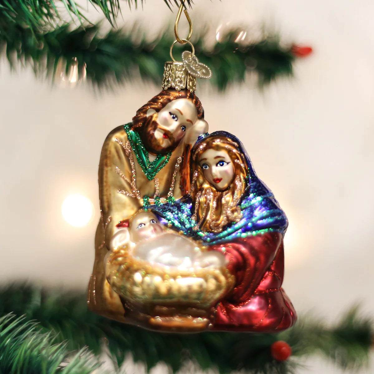 Old World Christmas Holy Family glass ornament Mary, Joseph and Baby Jesus in a manger
