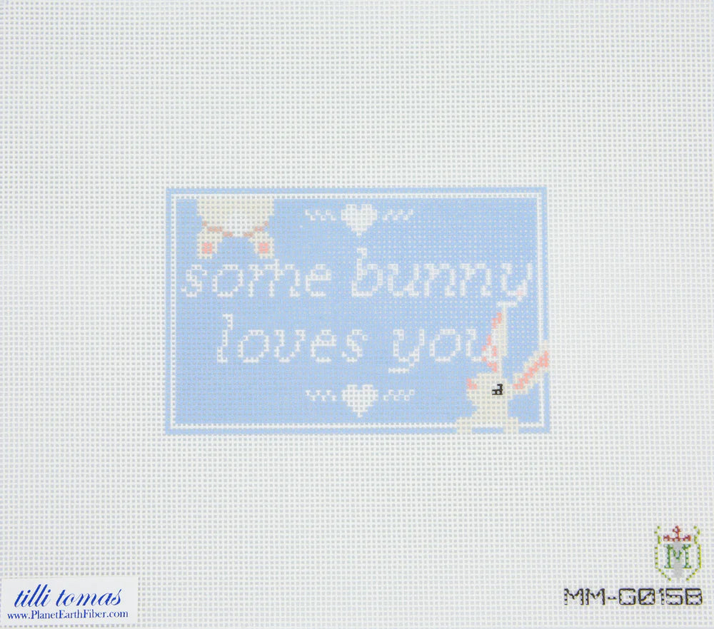 Cross-stitch pattern with 'some bunny loves you' text on a light blue background