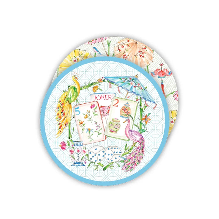 Two round paper plates featuring a whimsical watercolor illustration of playing cards, peacocks, flowers, and umbrellas, with a light blue border.