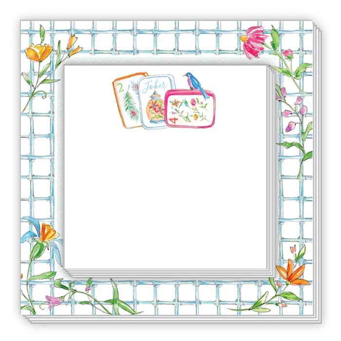 A square white notepad or paper pad with a decorative border. The border features a light blue grid pattern with watercolor-style floral illustrations in orange, pink, yellow, and green along the edges.