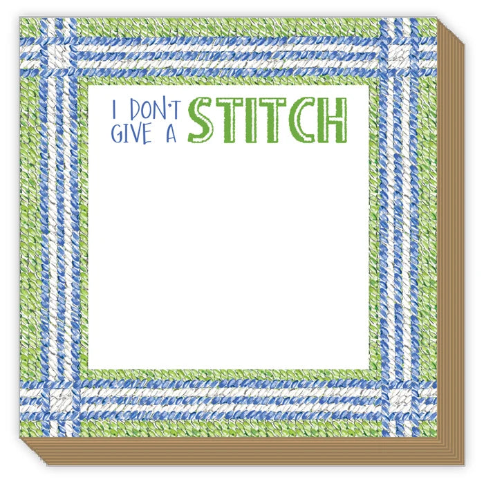 A square paper napkin or coaster with a white center and a decorative border. The border has a stitched-look pattern in blue and green, with the text 'I DON'T GIVE A STITCH' printed at the top.