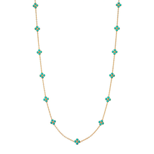 Gold necklace with turquoise stones on a white background