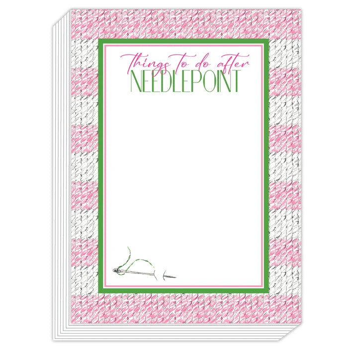 A stack of needlepoint notepads with a pink and white textured border and a green inner border. The top pad reads 'Things to do after NEEDLEPOINT' in pink and green text on a white background.