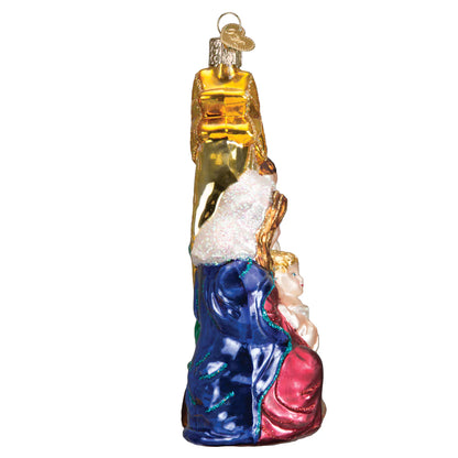 Decorative glass ornament of a woman holding a child on a white background