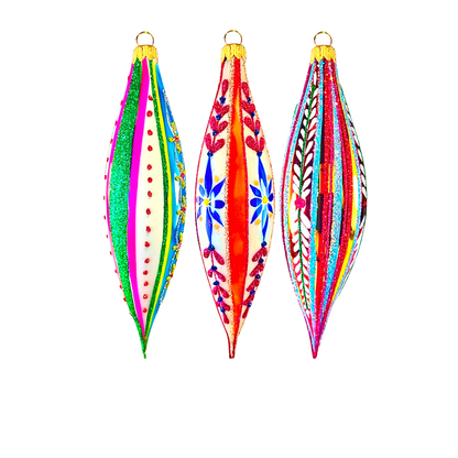 A set of three colorful, patterned Christmas ornaments in the shape of elongated teardrop or cones, with a glossy finish and looped tops for hanging.