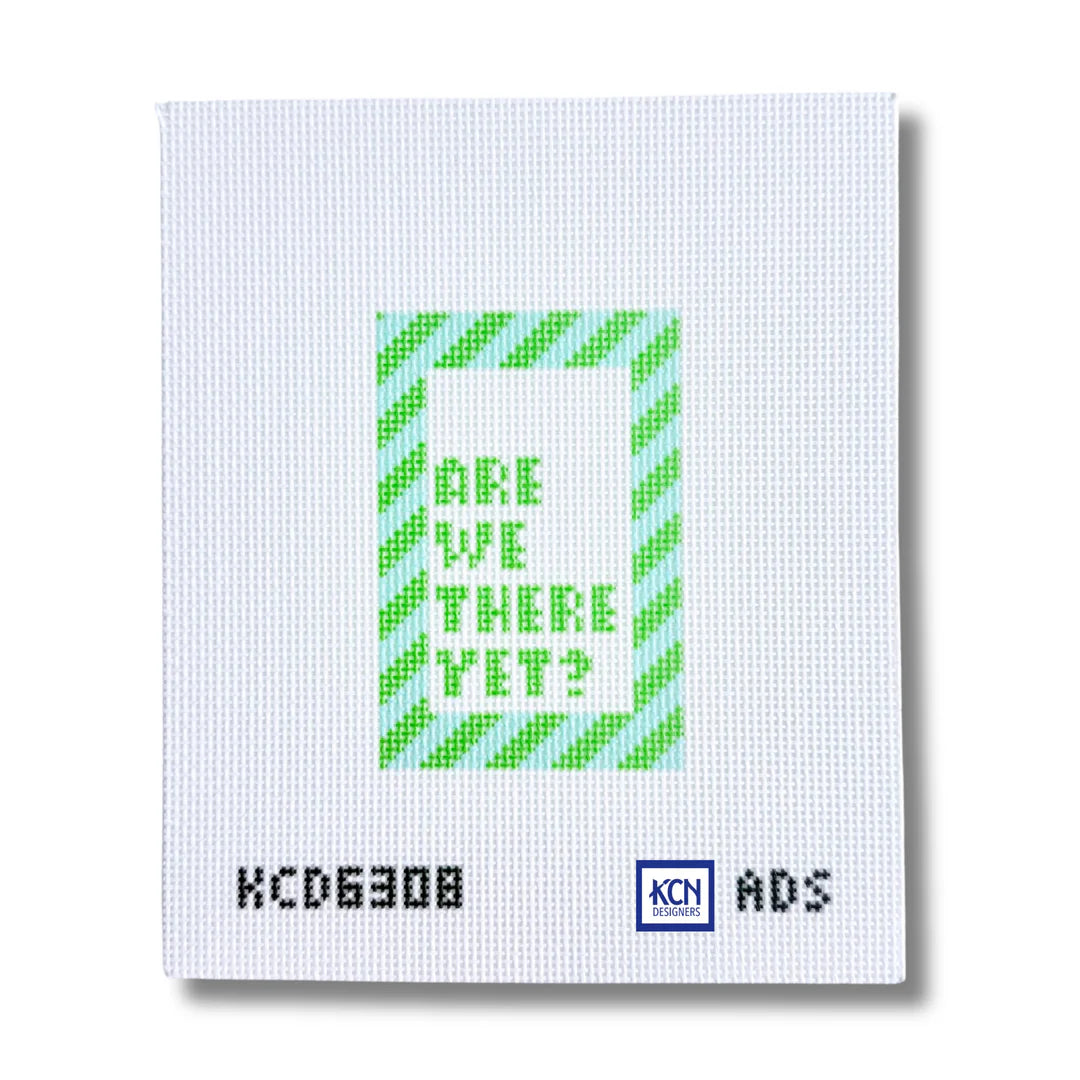 A square white canvas or print with a central green and light blue pixelated design reading “ARE WE THERE YET?” and black text at the bottom including “KCD6308” and a small blue “KCN” mark.