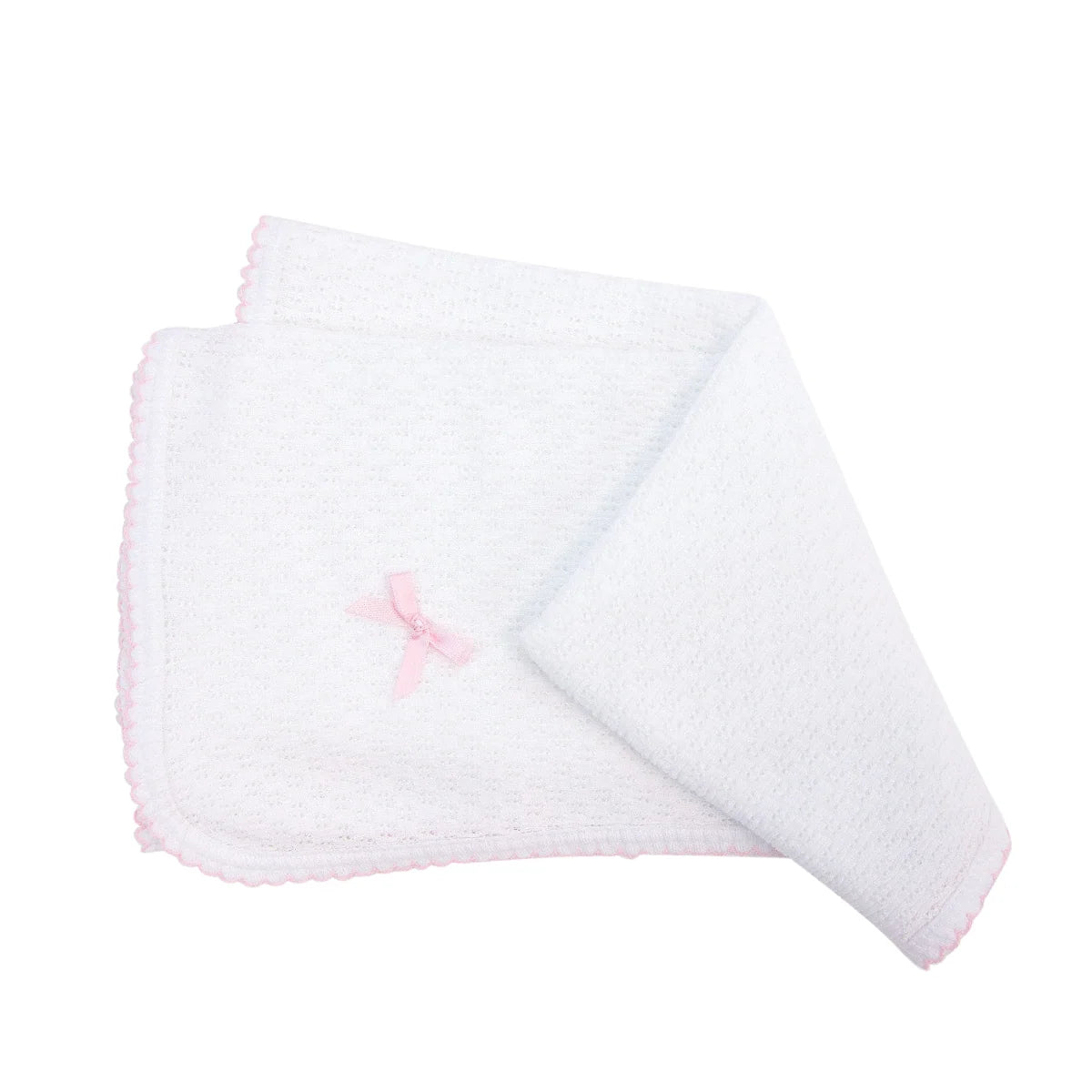 white baby blanket with light pink trim and small bow