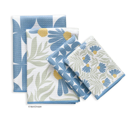 Set of four floral patterned napkins on a white background
