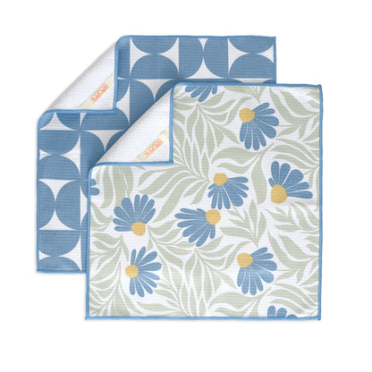 Two patterned cloths with floral and geometric designs on a white background