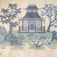 Embroidered design of a blue pagoda with trees and garden elements on a beige background.