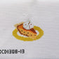 Cross-stitched design of a fish on a plate with 'KCD1308-13' label on fabric background