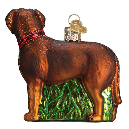 Glass ornament of a dog with a red collar on a white background