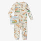 Children's pajama set with fox pattern and book titled 'Guess How Much I Love You' on a white background