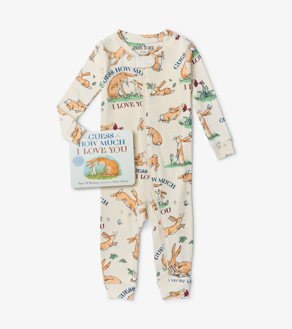 Children's pajama set with fox pattern and book titled 'Guess How Much I Love You' on a white background