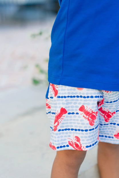 Blue and white shorts with red lobster pattern