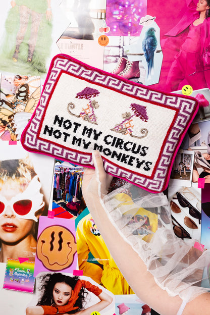 Textile with 'Not My Circus, Not My Monkeys' message held over a colorful collage of people and fashion.