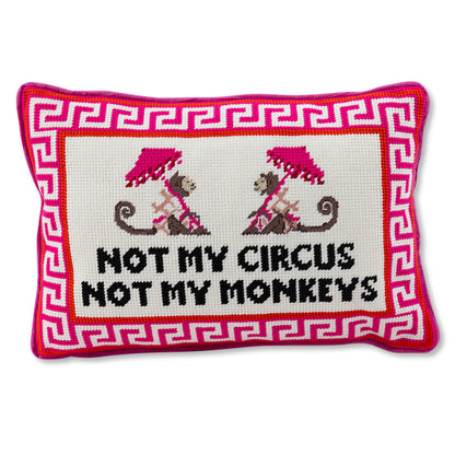 Decorative pillow with 'Not my circus, not my monkeys' text and monkey illustrations on a white background.