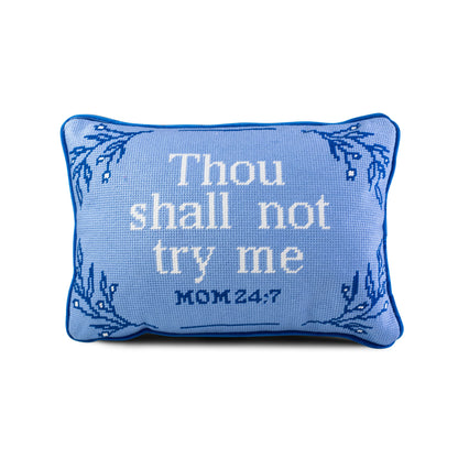A blue needlepoint pillow with the text 'Thou shall not try me' and the Bible verse 'MOM 24:7' embroidered on it