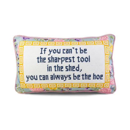 Decorative pillow with text and floral border on a white background