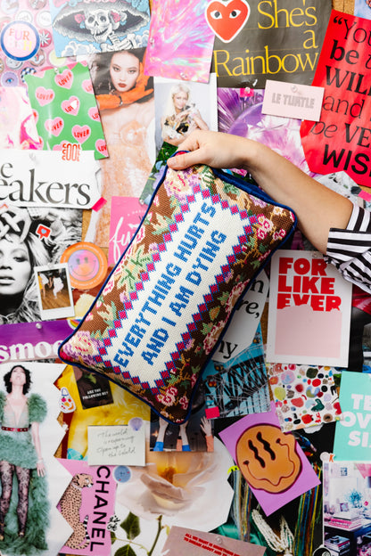 Person holding a colorful bag with text amidst a collage of magazine clippings and images.