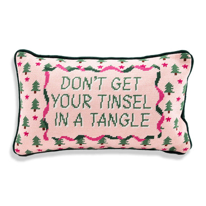 Decorative pillow with Christmas-themed design and text on a white background
