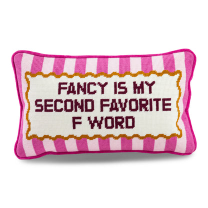 Decorative pillow with text 'Fancy is my second favorite F word' on a white background