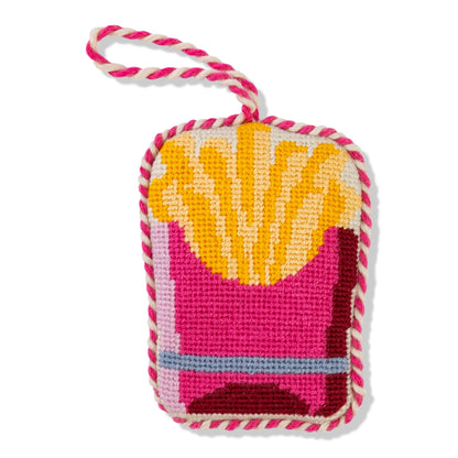 Colorful knitted pouch with a pink handle on a white background
