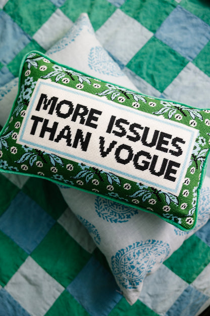 Pillow with 'More Issues Than Vogue' text on a green and blue checkered background