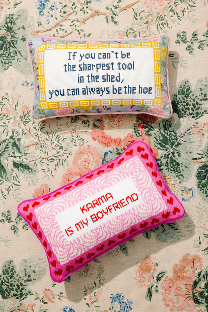 Two decorative pillows with text on a floral background