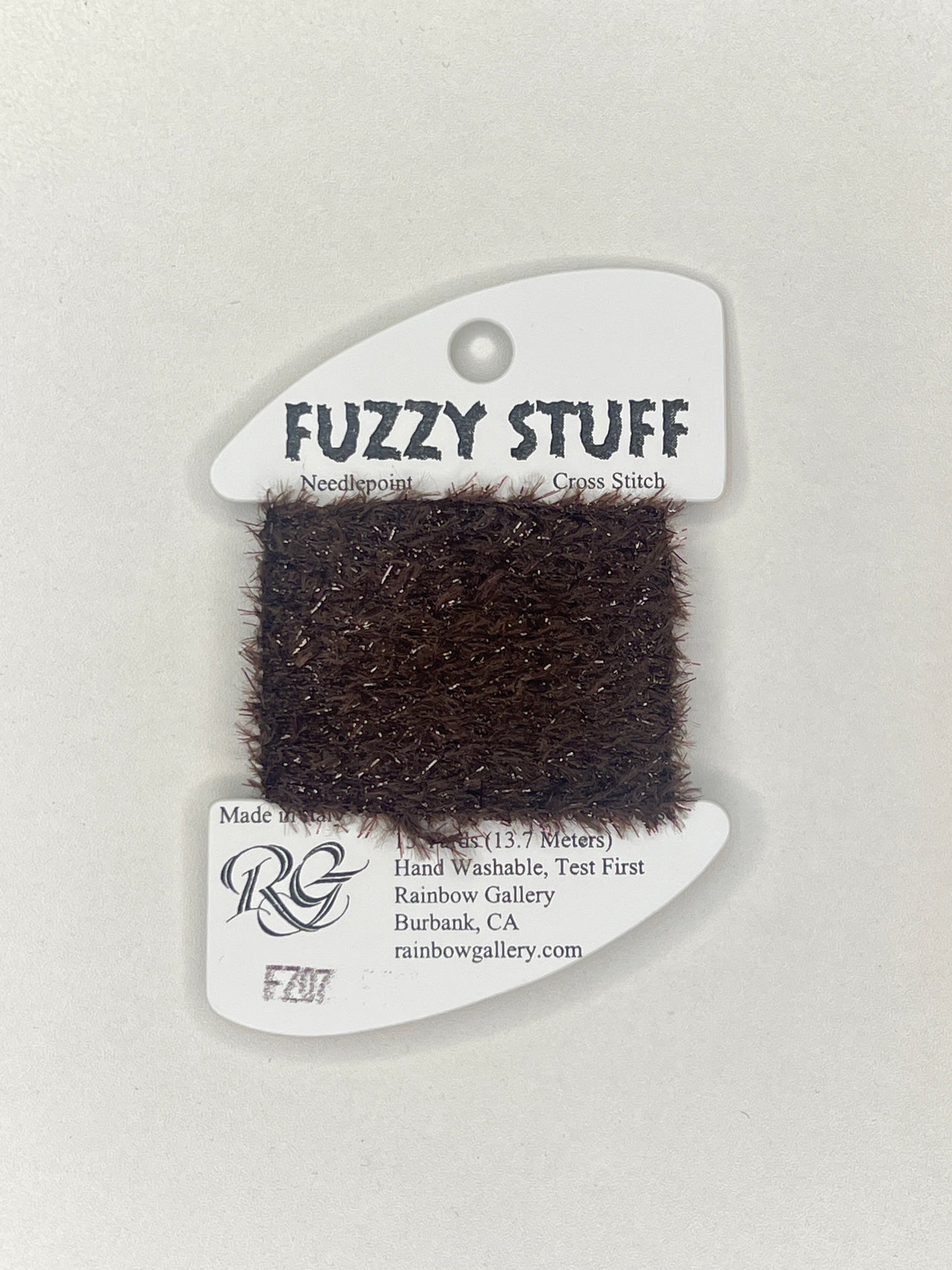 Sample of fuzzy material with a label on a light gray background