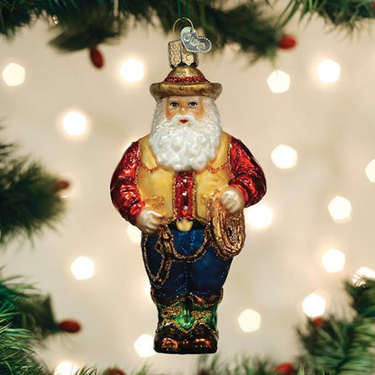 Decorative Santa Claus ornament on a Christmas tree with lights in the background