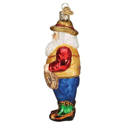 Decorative glass figure of a gnome holding a red heart on a white background