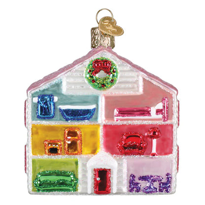 Colorful glass house ornament with a wreath on a white background