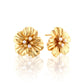 Gold floral earrings with pearl centers on a white background